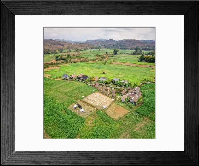 Framed Print : Aerial view of Houses in the middle of rice fields in Nan province, Thailand Framed Print : Aerial view of Houses in the middle of rice fields in Nan province, Thailand