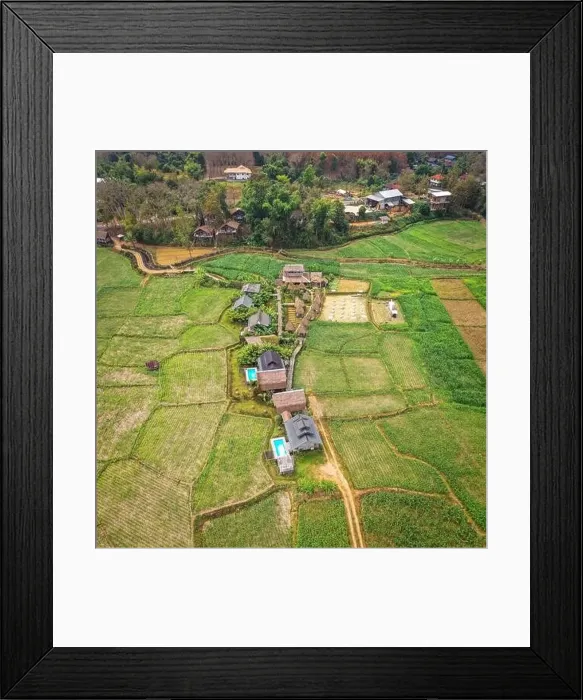 Framed Print : Aerial view of Houses in the middle of rice fields in Nan province, Thailand Framed Print : Aerial view of Houses in the middle of rice fields in Nan province, Thailand