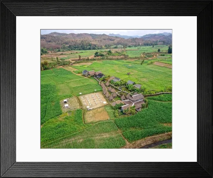 Framed Print : Aerial view of Houses in the middle of rice fields in Nan province, Thailand Framed Print : Aerial view of Houses in the middle of rice fields in Nan province, Thailand