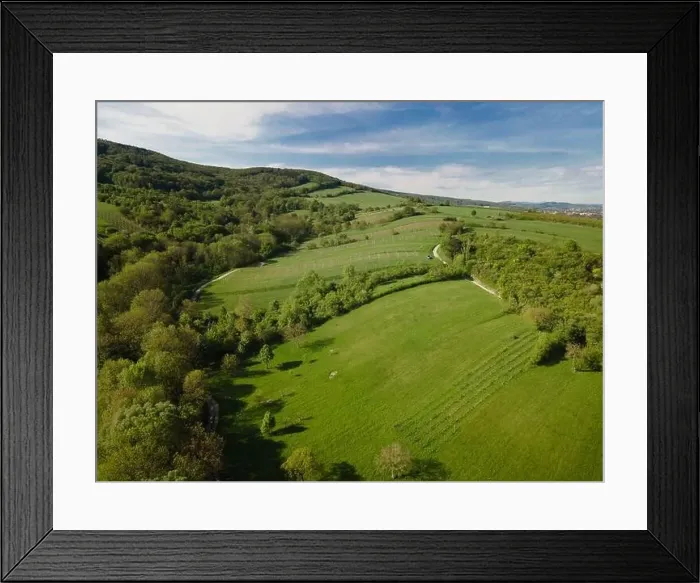 Framed Print : aerial drone flight over green meadows and forest in lower austria Framed Print : aerial drone flight over green meadows and forest in lower austria