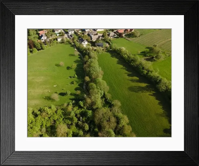 Framed Print : aerial drone flight over green meadows and forest in lower austria Framed Print : aerial drone flight over green meadows and forest in lower austria