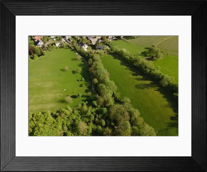 Framed Print : aerial drone flight over green meadows and forest in lower austria Framed Print : aerial drone flight over green meadows and forest in lower austria