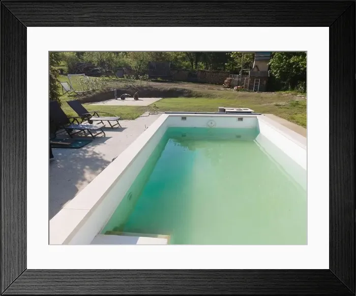 Framed Print : Drone flight over pool in the middle of greenery, fresh grass grown and the pool is not yet cleaned Framed Print : Drone flight over pool in the middle of greenery, fresh grass grown and the pool is not yet cleaned