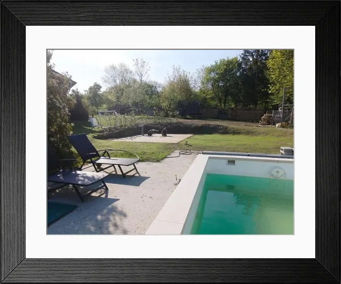 Framed Print : Drone flight over pool in the middle of greenery, fresh grass grown and the pool is not yet cleaned Framed Print : Drone flight over pool in the middle of greenery, fresh grass grown and the pool is not yet cleaned