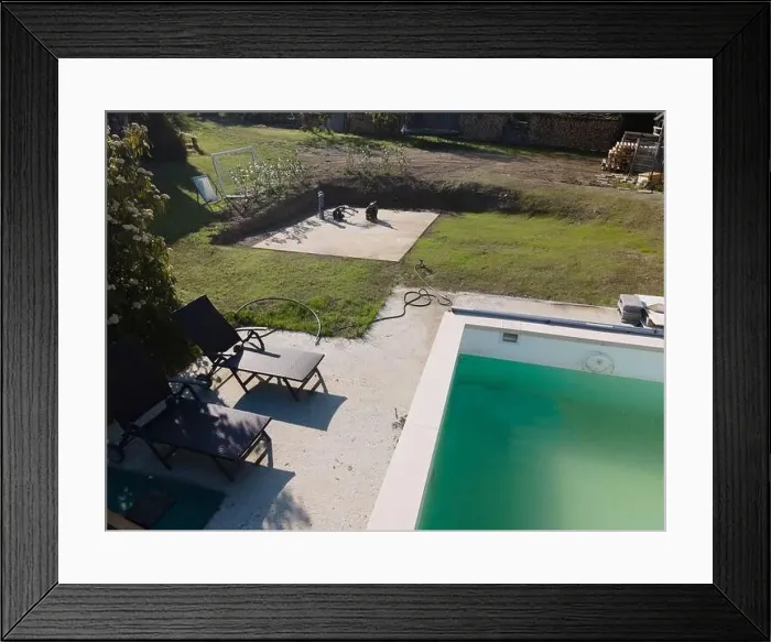 Framed Print : Drone flight over pool in the middle of greenery, fresh grass grown and the pool is not yet cleaned Framed Print : Drone flight over pool in the middle of greenery, fresh grass grown and the pool is not yet cleaned