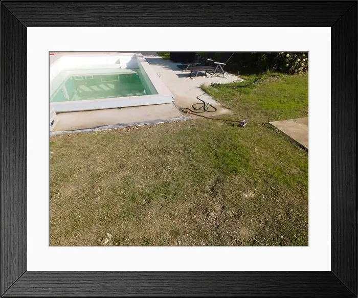 Framed Print : Drone flight over pool in the middle of greenery, fresh grass grown and the pool is not yet cleaned Framed Print : Drone flight over pool in the middle of greenery, fresh grass grown and the pool is not yet cleaned