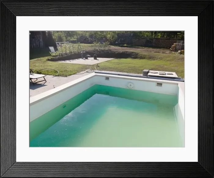 Framed Print : Drone flight over pool in the middle of greenery, fresh grass grown and the pool is not yet cleaned Framed Print : Drone flight over pool in the middle of greenery, fresh grass grown and the pool is not yet cleaned