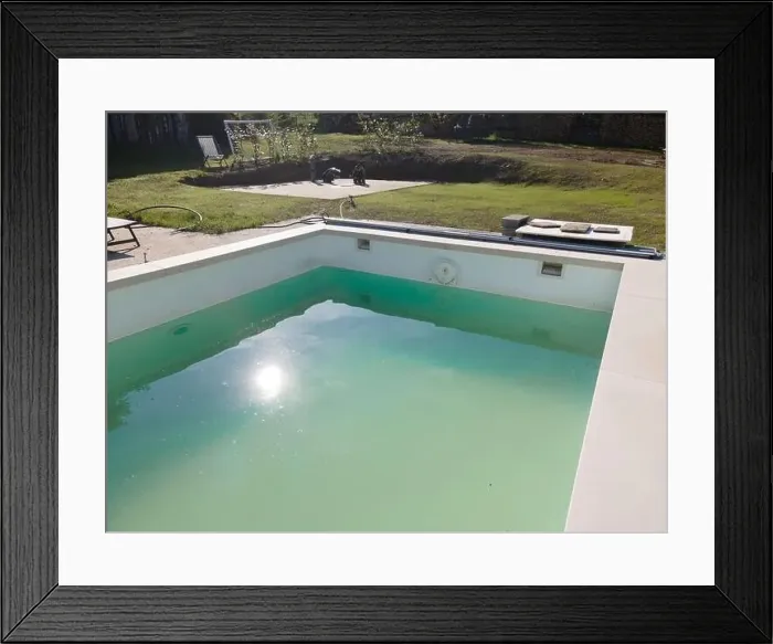 Framed Print : Drone flight over pool in the middle of greenery, fresh grass grown and the pool is not yet cleaned Framed Print : Drone flight over pool in the middle of greenery, fresh grass grown and the pool is not yet cleaned