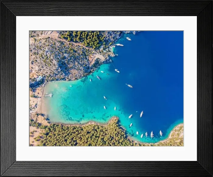 Framed Print : Aerial drone footage of daily tour boats and private yachts anchored in Cennet Bay Framed Print : Aerial drone footage of daily tour boats and private yachts anchored in Cennet Bay