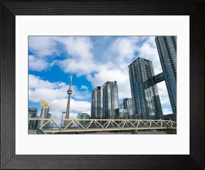 Framed Print : TORONTO, ONTARIO CANADA - AUGUST 23, 2021: Toronto's CityPlace condominiums near Lake Ontario Framed Print : TORONTO, ONTARIO CANADA - AUGUST 23, 2021: Toronto's CityPlace condominiums near Lake Ontario