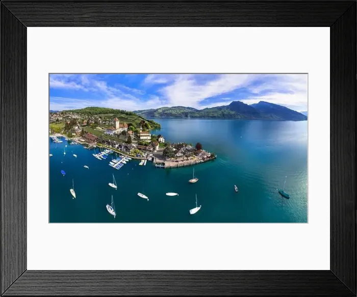 Framed Print : Stunning aerial drone panorama of lake Thun and the Spiez village with medieval castle Framed Print : Stunning aerial drone panorama of lake Thun and the Spiez village with medieval castle