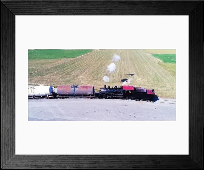 Framed Print : Aerial View of an Antique Steam Engine Doing Switching Dues at a Freight Yard in the Middle of Farmlands on a Sunny Day Framed Print : Aerial View of an Antique Steam Engine Doing Switching Dues at a Freight Yard in the Middle of Farmlands on a Sunny Day