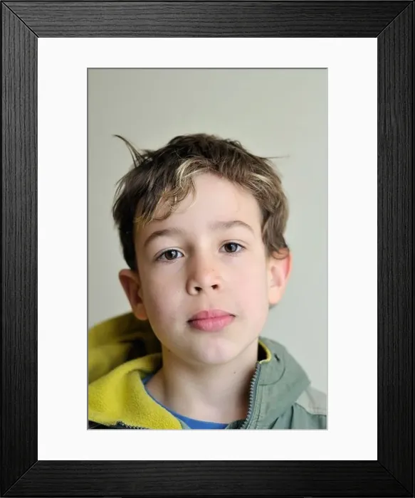 Framed Print : Portrait of a nine year old boy looking straight in the camera Framed Print : Portrait of a nine year old boy looking straight in the camera