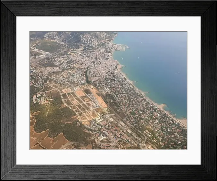 Framed Print : Aerial view on beautiful Sitges town in summer, Spain, view from the plain Framed Print : Aerial view on beautiful Sitges town in summer, Spain, view from the plain