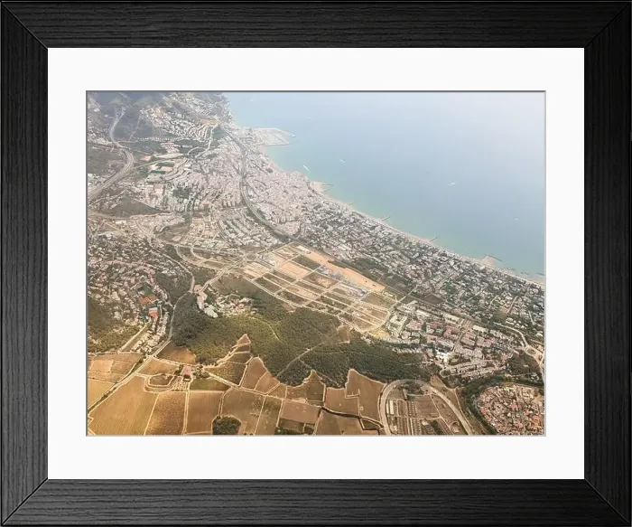 Framed Print : Aerial view on beautiful Sitges town in summer, Spain, view from the plain Framed Print : Aerial view on beautiful Sitges town in summer, Spain, view from the plain