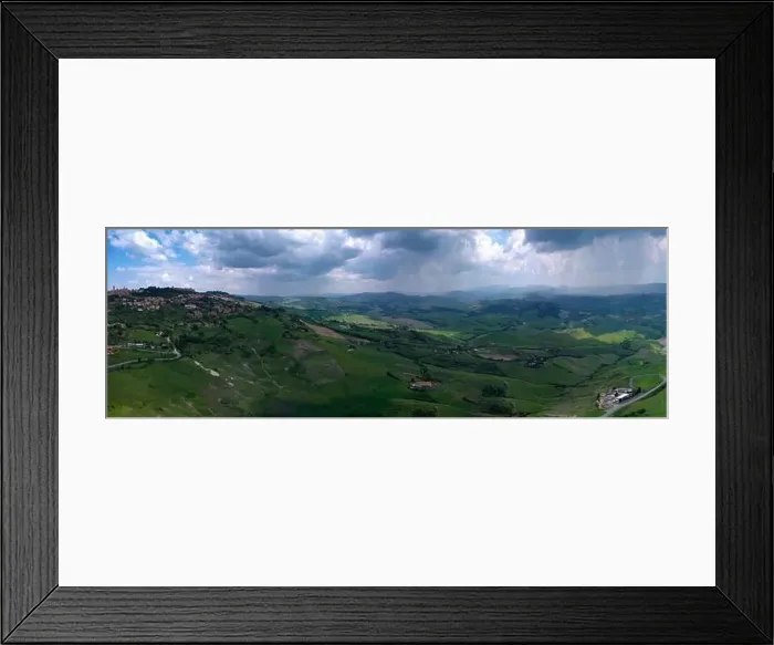 Framed Print : Aerial view on Volterra town and the surroundings on a stormy day Framed Print : Aerial view on Volterra town and the surroundings on a stormy day