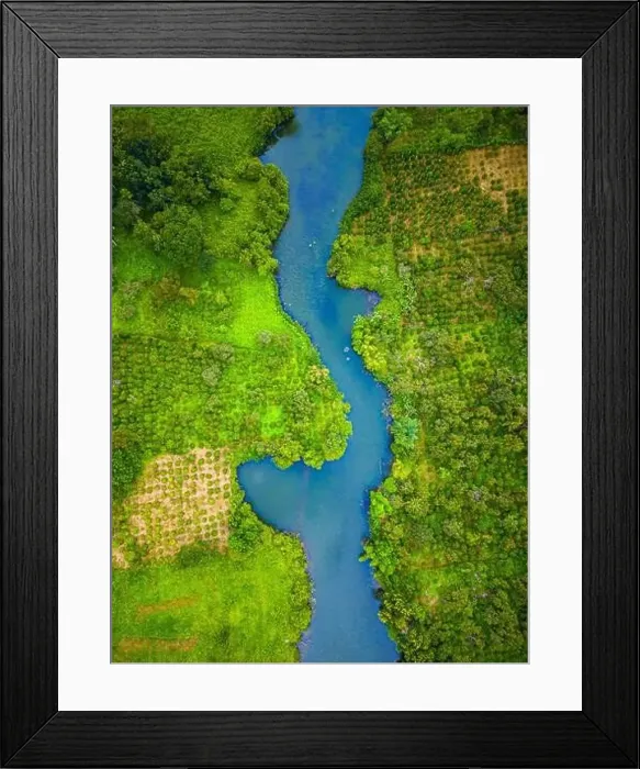 Framed Print : Aerial landscape of winding clear blue river in green field Framed Print : Aerial landscape of winding clear blue river in green field