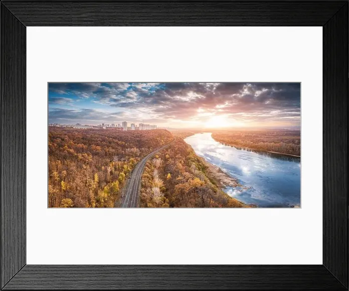 Framed Print : Aerial scenic panorama of railroad at city suburbs. Majestic sunset clouds reflecting in the river waters Framed Print : Aerial scenic panorama of railroad at city suburbs. Majestic sunset clouds reflecting in the river waters