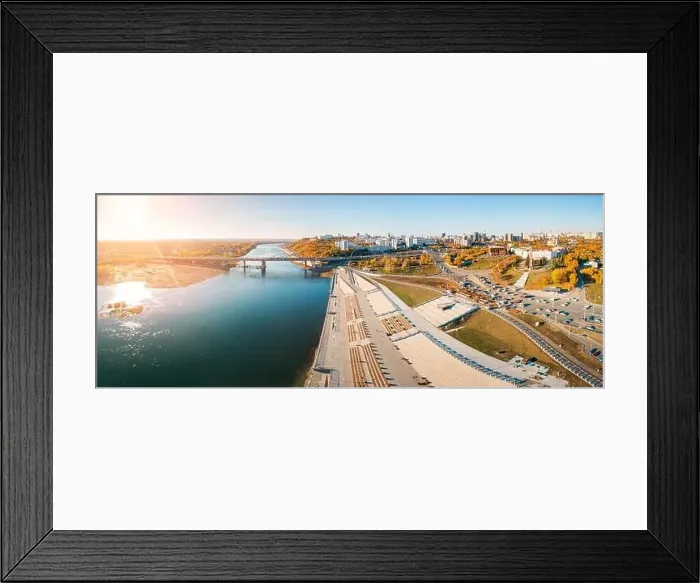 Framed Print : Bridge and busy city street leads along the embankment of a large river Framed Print : Bridge and busy city street leads along the embankment of a large river