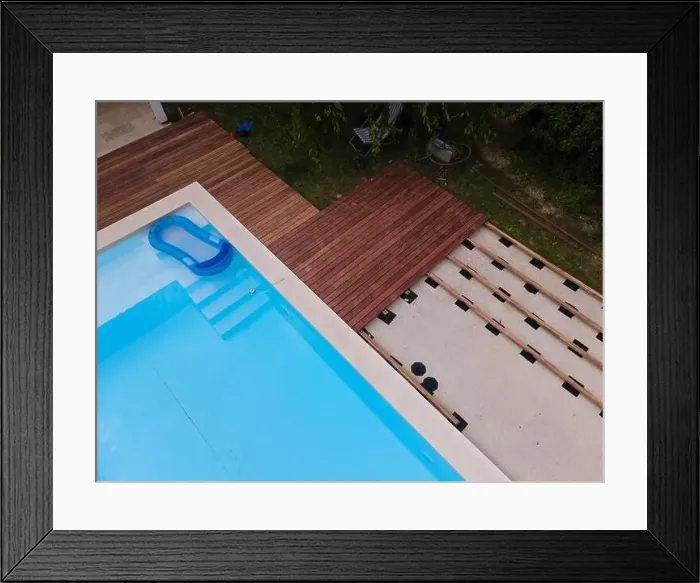 Framed Print : Drone flight over beautiful green garden with pool and the wooden terrace of the pool is currently in progress Framed Print : Drone flight over beautiful green garden with pool and the wooden terrace of the pool is currently in progress