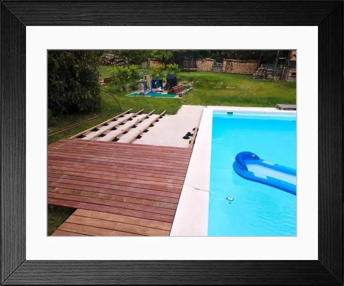 Framed Print : Drone flight over beautiful green garden with pool and the wooden terrace of the pool is currently in progress Framed Print : Drone flight over beautiful green garden with pool and the wooden terrace of the pool is currently in progress