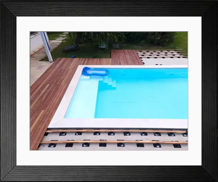 Framed Print : Drone flight over beautiful green garden with pool and the wooden terrace of the pool is currently in progress Framed Print : Drone flight over beautiful green garden with pool and the wooden terrace of the pool is currently in progress