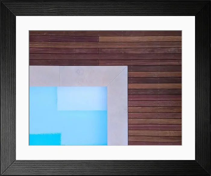 Framed Print : Drone flight over beautiful green garden with pool and the wooden terrace of the pool is currently in progress Framed Print : Drone flight over beautiful green garden with pool and the wooden terrace of the pool is currently in progress