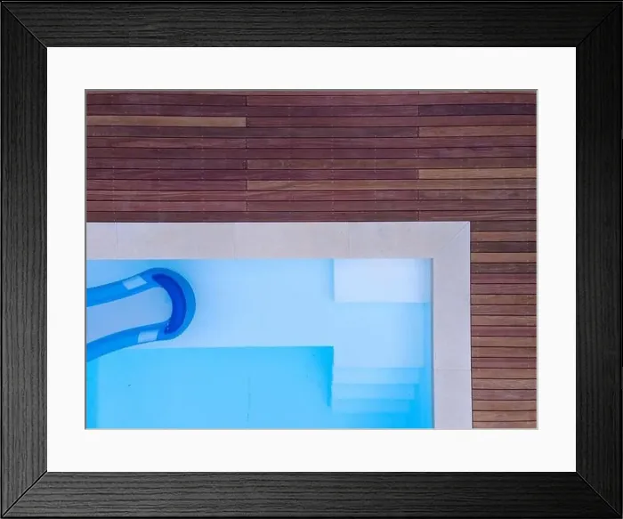 Framed Print : Drone flight over beautiful green garden with pool and the wooden terrace of the pool is currently in progress Framed Print : Drone flight over beautiful green garden with pool and the wooden terrace of the pool is currently in progress