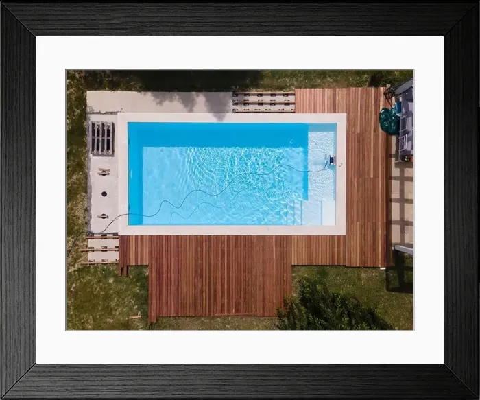 Framed Print : aerial drone flight over beautiful green garden with pool and the wooden deck of the pool is in progress Framed Print : aerial drone flight over beautiful green garden with pool and the wooden deck of the pool is in progress