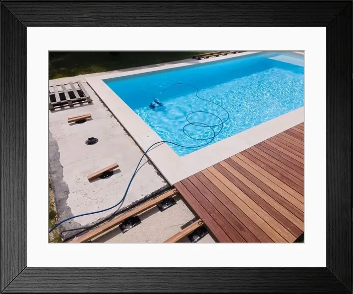 Framed Print : aerial drone flight over beautiful green garden with pool and the wooden deck of the pool is in progress Framed Print : aerial drone flight over beautiful green garden with pool and the wooden deck of the pool is in progress
