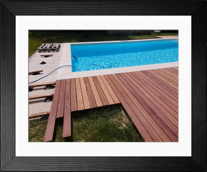 Framed Print : aerial drone flight over beautiful green garden with pool and the wooden deck of the pool is in progress Framed Print : aerial drone flight over beautiful green garden with pool and the wooden deck of the pool is in progress