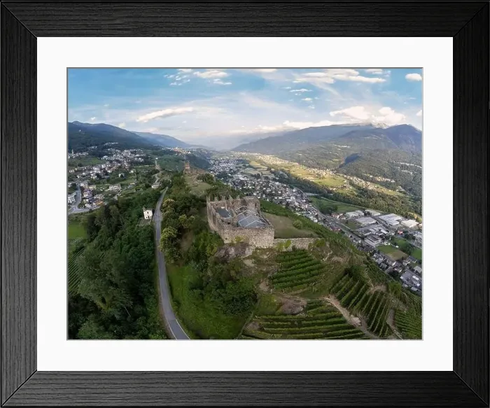 Framed Print : Aerial View - Terraced vineyards in the hills of Valtellina planted near monuments and old medieval ruins - Sondrio Framed Print : Aerial View - Terraced vineyards in the hills of Valtellina planted near monuments and old medieval ruins - Sondrio