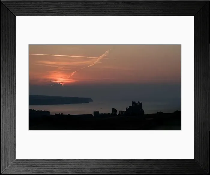 Framed Print : Drone shot of a sunset over Whitby Abbey, North Yorkshire Framed Print : Drone shot of a sunset over Whitby Abbey, North Yorkshire