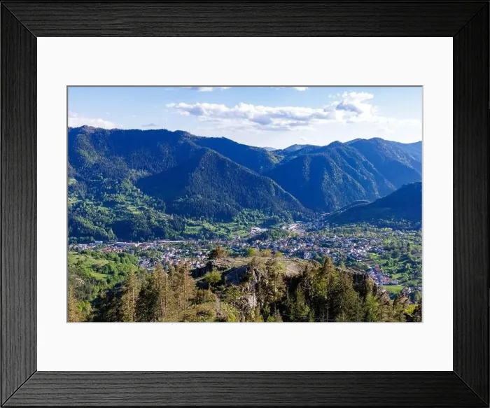 Framed Print : View from high rock to old village town of Smolyan with green meadows for cattle walking and ancient houses Framed Print : View from high rock to old village town of Smolyan with green meadows for cattle walking and ancient houses