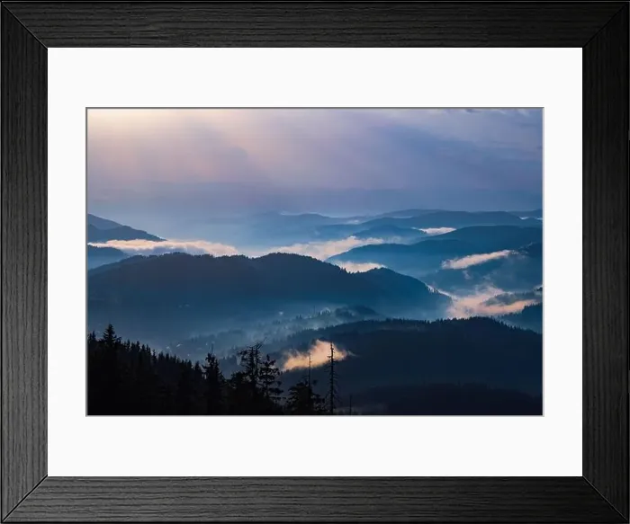 Framed Print : Cold cloudy rainy weather over low hills covered with spruce evergreen forests in Rhodope Mountains against backdrop of
