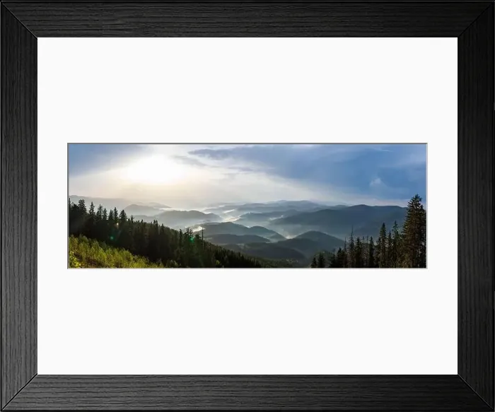 Framed Print : Panorama on cold cloudy weather over low hills covered with spruce evergreen forests in Rhodope Mountains against