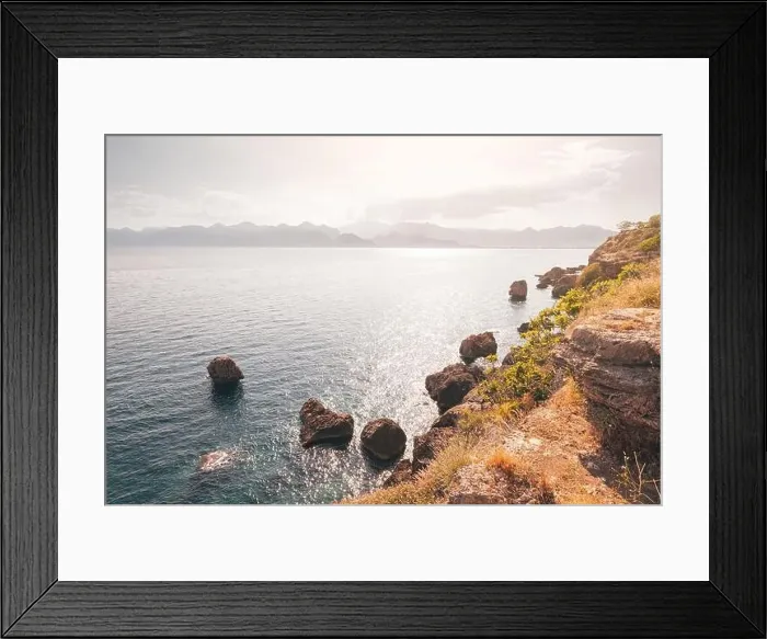 Framed Print : Scenic seascape view with rocks and cliffs in shallow waters, during high tide. Moody picture Framed Print : Scenic seascape view with rocks and cliffs in shallow waters, during high tide. Moody picture