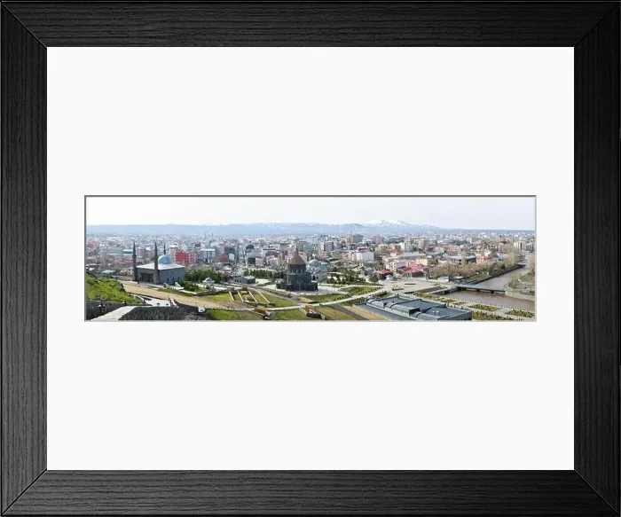 Framed Print : Aerial view Kars city panorama buildings with buildings and mountains background. Travel holidays in Kars Framed Print : Aerial view Kars city panorama buildings with buildings and mountains background. Travel holidays in Kars
