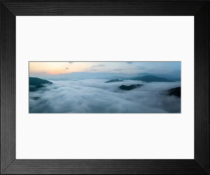 Framed Print : Panorama of sea of clouds around mountain peaks at sunrise Framed Print : Panorama of sea of clouds around mountain peaks at sunrise