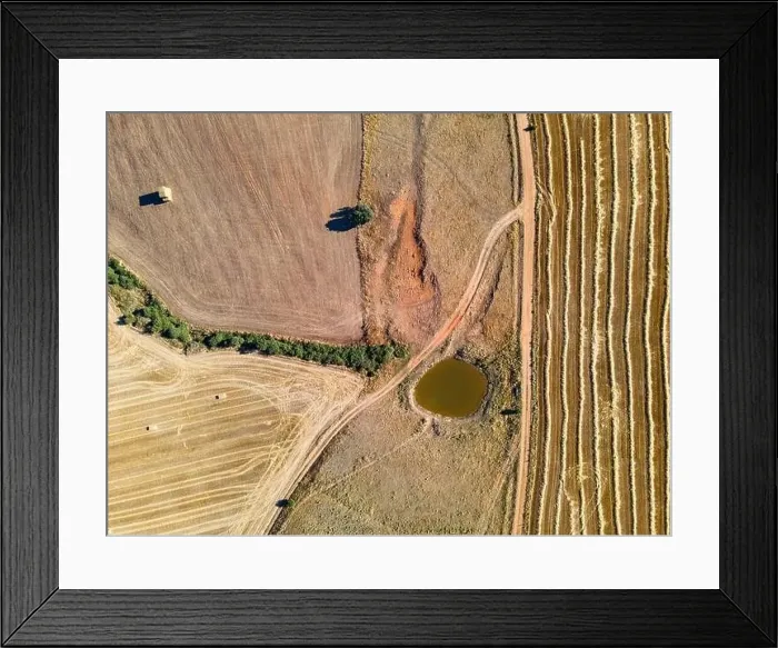 Framed Print : Aerial view of farm fields, dirt roads and water basin Framed Print : Aerial view of farm fields, dirt roads and water basin
