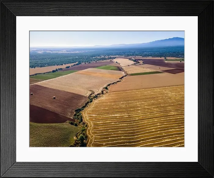 Framed Print : Farm fields at the foot of the mountains at sunrise on a summer day. Segovia Framed Print : Farm fields at the foot of the mountains at sunrise on a summer day. Segovia