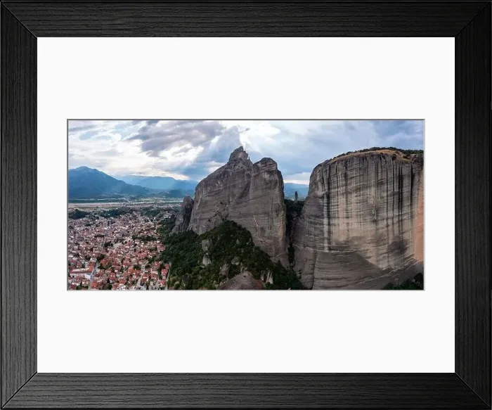 Framed Print : Meteora Greece. Blue sky with clouds over Monastery buildings on top of rocks and Kalambaka town and valley Framed Print : Meteora Greece. Blue sky with clouds over Monastery buildings on top of rocks and Kalambaka town and valley