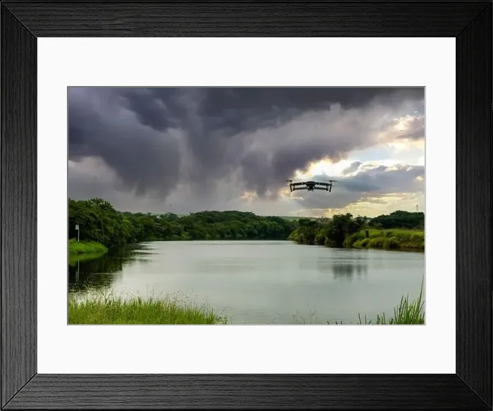 Framed Print : photo of a drone flying over the tiete river in a cloudy morning Framed Print : photo of a drone flying over the tiete river in a cloudy morning