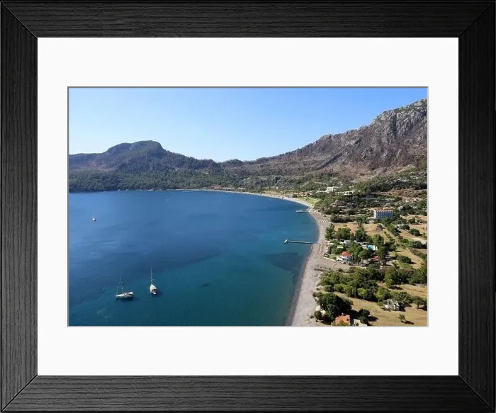 Framed Print : Picturesque view from cape Asarjik to Kumlubuk bay in Mediterranean sea with yachts and beach hotels Framed Print : Picturesque view from cape Asarjik to Kumlubuk bay in Mediterranean sea with yachts and beach hotels