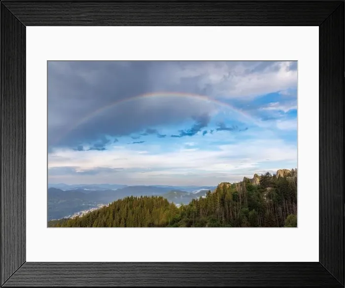 Framed Print : Bright multicolored natural rainbow with different colors on a light daytime cloudy sky Framed Print : Bright multicolored natural rainbow with different colors on a light daytime cloudy sky