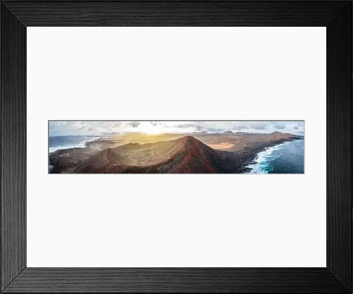 Framed Print : aerial panorama view on volcano and mountains on coast with ocean waves on lanzarote during sunrise Framed Print : aerial panorama view on volcano and mountains on coast with ocean waves on lanzarote during sunrise