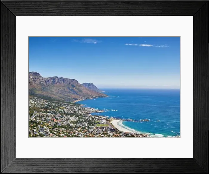 Framed Print : Aerial panorama photo of Camps Bay. Aerial view of town near sea against sky Framed Print : Aerial panorama photo of Camps Bay. Aerial view of town near sea against sky