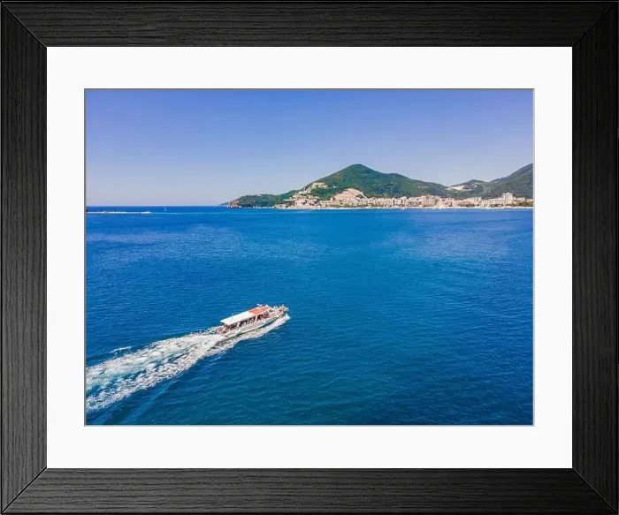Framed Print : Ferry boat with tourists on the move on floats on turquoise water. Drone view Framed Print : Ferry boat with tourists on the move on floats on turquoise water. Drone view