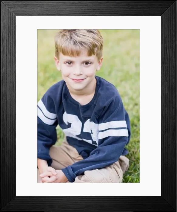 Framed Print : Caucasian boy smiling on lawn Framed Print : Caucasian boy smiling on lawn