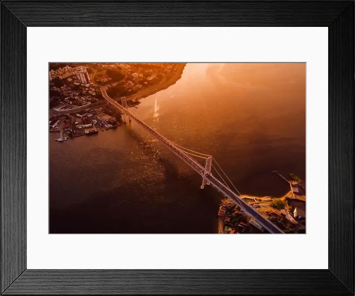 Framed Print : Hercilio luz cable bridge with sunset light in Florianopolis, Brazil. Aerial view Framed Print : Hercilio luz cable bridge with sunset light in Florianopolis, Brazil. Aerial view